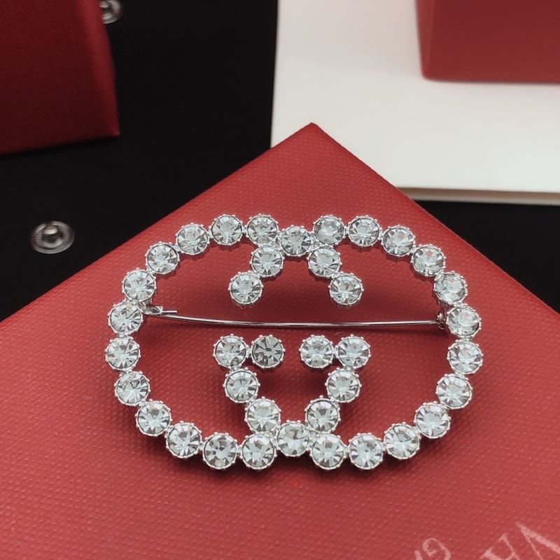 Gvc*1 brooches